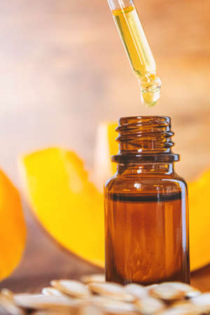Pumpkin seed oil in a bottle. Selective focus. Nature.の写真素材