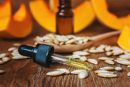 Pumpkin seed oil in a bottle. Selective focus. Nature.の写真素材