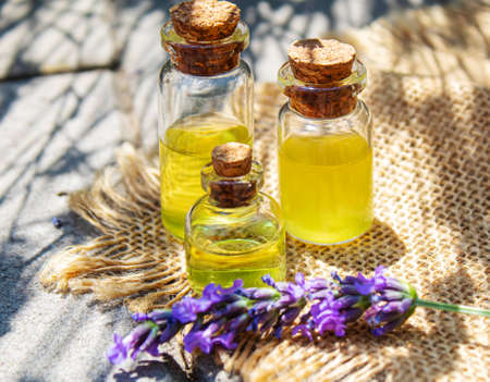 Lavender essential oil in a small bottle. Selective focus.natureの写真素材