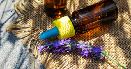 Lavender essential oil in a small bottle. Selective focus.natureの写真素材