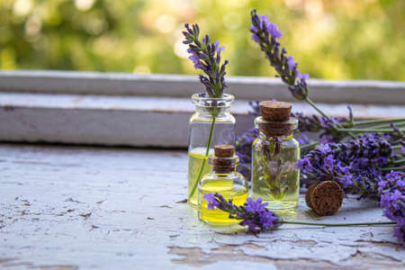 Lavender essential oil in a small bottle. Selective focus.natureの写真素材