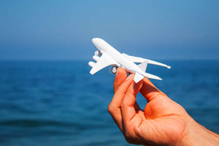 man with planes in his hands on the beach. Selective focus. holiday.の写真素材