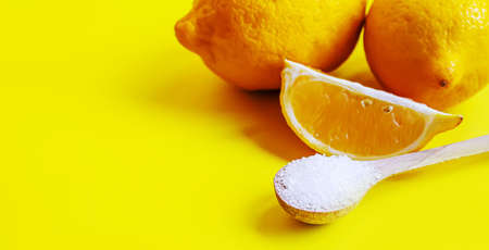 Citric acid on a yellow background. Selective focus.natureの写真素材