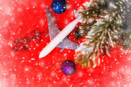 Travel for Christmas. Airplane with Christmas decor.New year.Selective focus.holidaysの写真素材