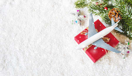 Travel for Christmas. Airplane with Christmas decor.New year.Selective focus. holidaysの写真素材