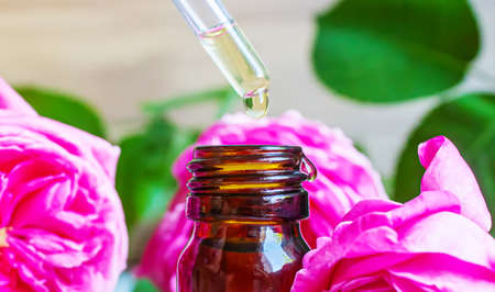 tea rose oil in a small bottle. selective focus.natureの写真素材