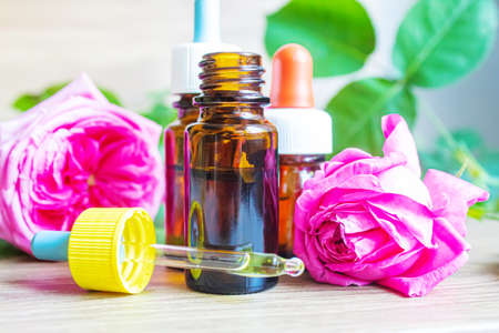 tea rose oil in a small bottle. selective focus.natureの写真素材