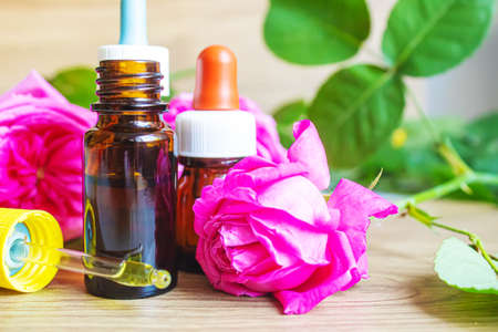 tea rose oil in a small bottle. selective focus.natureの写真素材