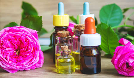 tea rose oil in a small bottle. selective focus.natureの写真素材