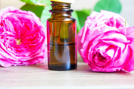 tea rose oil in a small bottle. selective focus.natureの写真素材