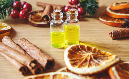 Christmas essential oils in a small bottle. Selective focus. Holiday.の写真素材