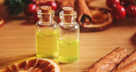 Christmas essential oils in a small bottle. Selective focus. Holiday.の写真素材