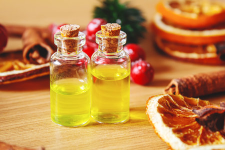 Christmas essential oils in a small bottle. Selective focus. Holiday.の写真素材