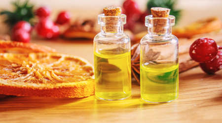 Christmas essential oils in a small bottle. Selective focus. Holiday.の写真素材