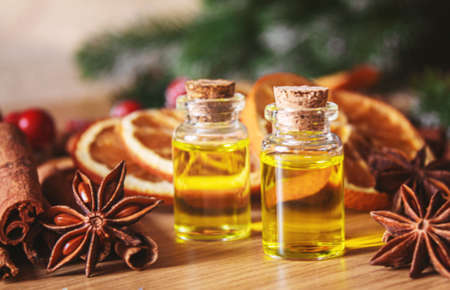 Christmas essential oils in a small bottle. Selective focus. Holiday.の写真素材