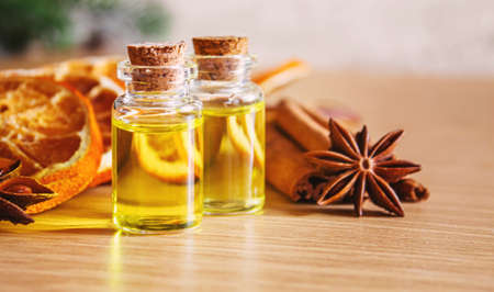 Christmas essential oils in a small bottle. Selective focus. Holiday.の写真素材