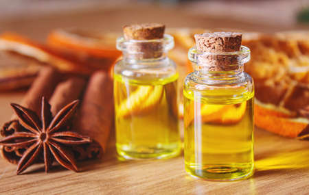 Christmas essential oils in a small bottle. Selective focus. Holiday.の写真素材