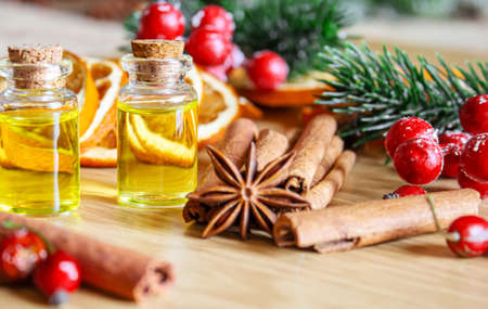 Christmas essential oils in a small bottle. Selective focus. Holiday.の写真素材