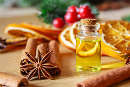 Christmas essential oils in a small bottle. Selective focus. Holiday.の写真素材