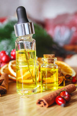 Christmas essential oils in a small bottle. Selective focus. Holiday.の写真素材