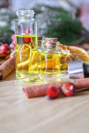 Christmas essential oils in a small bottle. Selective focus. Holiday.の写真素材