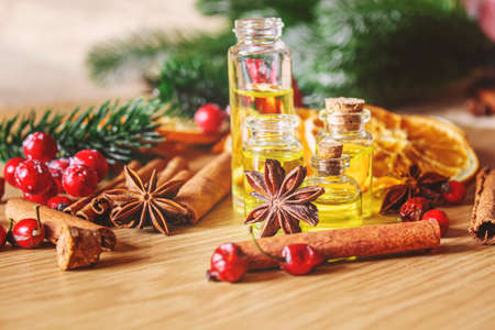 Christmas essential oils in a small bottle. Selective focus. Holiday.の写真素材