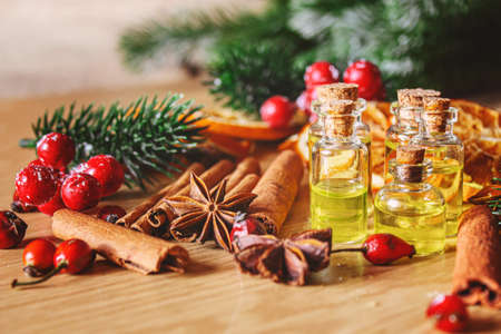 Christmas essential oils in a small bottle. Selective focus. Holiday.の写真素材
