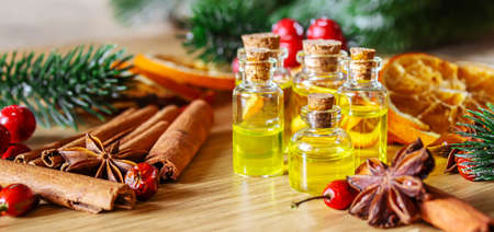 Christmas essential oils in a small bottle. Selective focus. Holiday.の写真素材