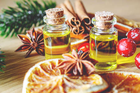 Christmas essential oils in a small bottle. Selective focus. Holiday.の写真素材