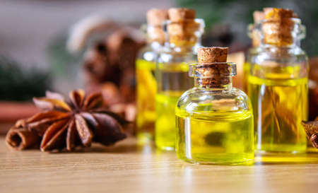 Christmas essential oils in a small bottle. Selective focus. Holiday.の写真素材