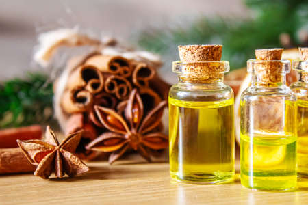 Christmas essential oils in a small bottle. Selective focus. Holiday.の写真素材
