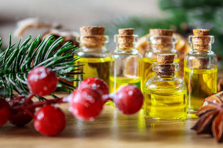 Christmas essential oils in a small bottle. Selective focus. Holiday.の写真素材