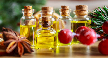 Christmas essential oils in a small bottle. Selective focus. Holiday.の写真素材