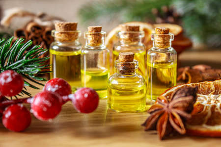 Christmas essential oils in a small bottle. Selective focus. Holiday.の写真素材