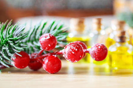 Christmas essential oils in a small bottle. Selective focus. Holiday.の写真素材
