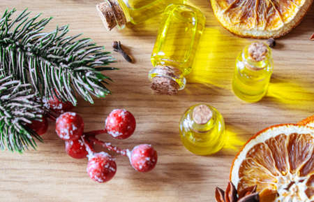 Christmas essential oils in a small bottle. Selective focus. Holiday.の写真素材