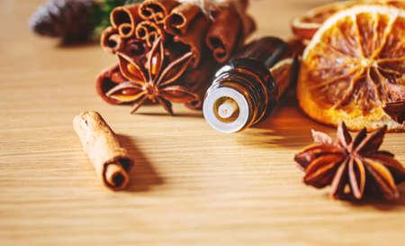 Christmas essential oils in a small bottle. Selective focus. Holiday.の写真素材