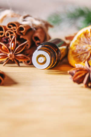 Christmas essential oils in a small bottle. Selective focus. Holiday.の写真素材
