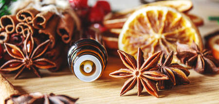 Christmas essential oils in a small bottle. Selective focus. Holiday.の写真素材