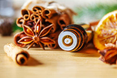 Christmas essential oils in a small bottle. Selective focus. Holiday.の写真素材