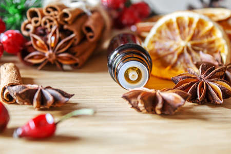 Christmas essential oils in a small bottle. Selective focus. Holiday.の写真素材
