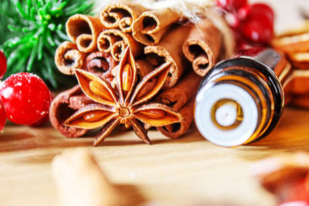 Christmas essential oils in a small bottle. Selective focus. Holiday.の写真素材