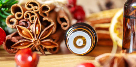 Christmas essential oils in a small bottle. Selective focus. Holiday.の写真素材