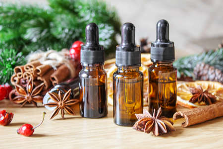 Christmas essential oils in a small bottle. Selective focus. Holiday.の写真素材