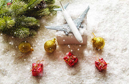Travel for Christmas. Airplane with Christmas decor.New year.Selective focus.holidaysの写真素材