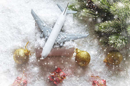 Travel for Christmas. Airplane with Christmas decor.New year.Selective focus.holidaysの写真素材