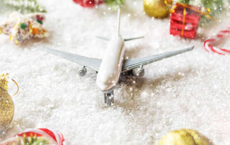 Travel for Christmas. Airplane with Christmas decor.New year.Selective focus.holidaysの写真素材