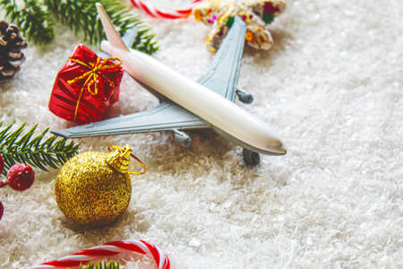 Travel for Christmas. Airplane with Christmas decor.New year.Selective focus.holidaysの写真素材
