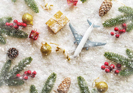 Travel for Christmas. Airplane with Christmas decor.New year.Selective focus.holidaysの写真素材