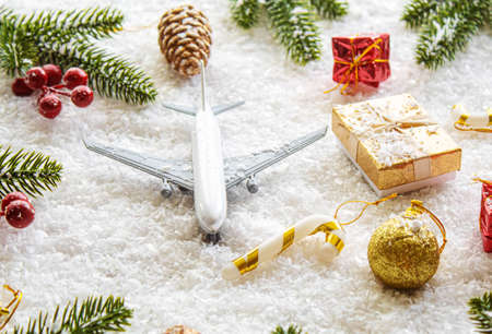 Travel for Christmas. Airplane with Christmas decor.New year.Selective focus.holidaysの写真素材